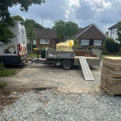 Prepared driveway and patio base at a house