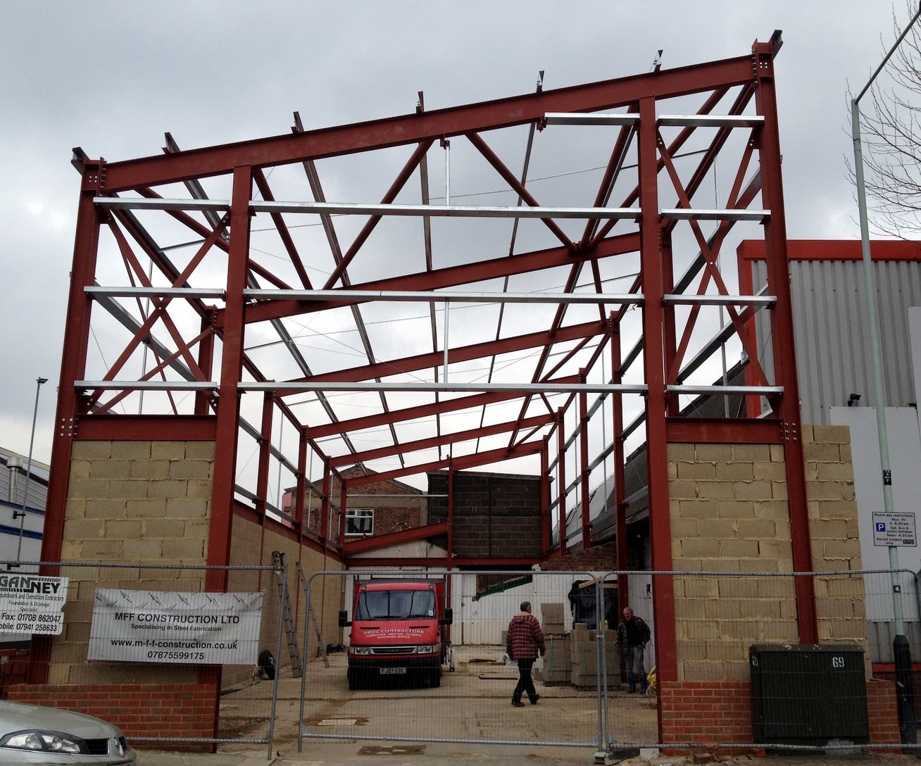 A steel frame under construction on a Ganney Beam & Foundation site